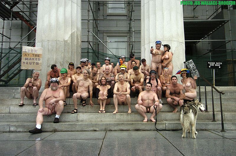 Naked bicycle riders at the Statehouse in Montpelier, Vermont, USA: June 2011.